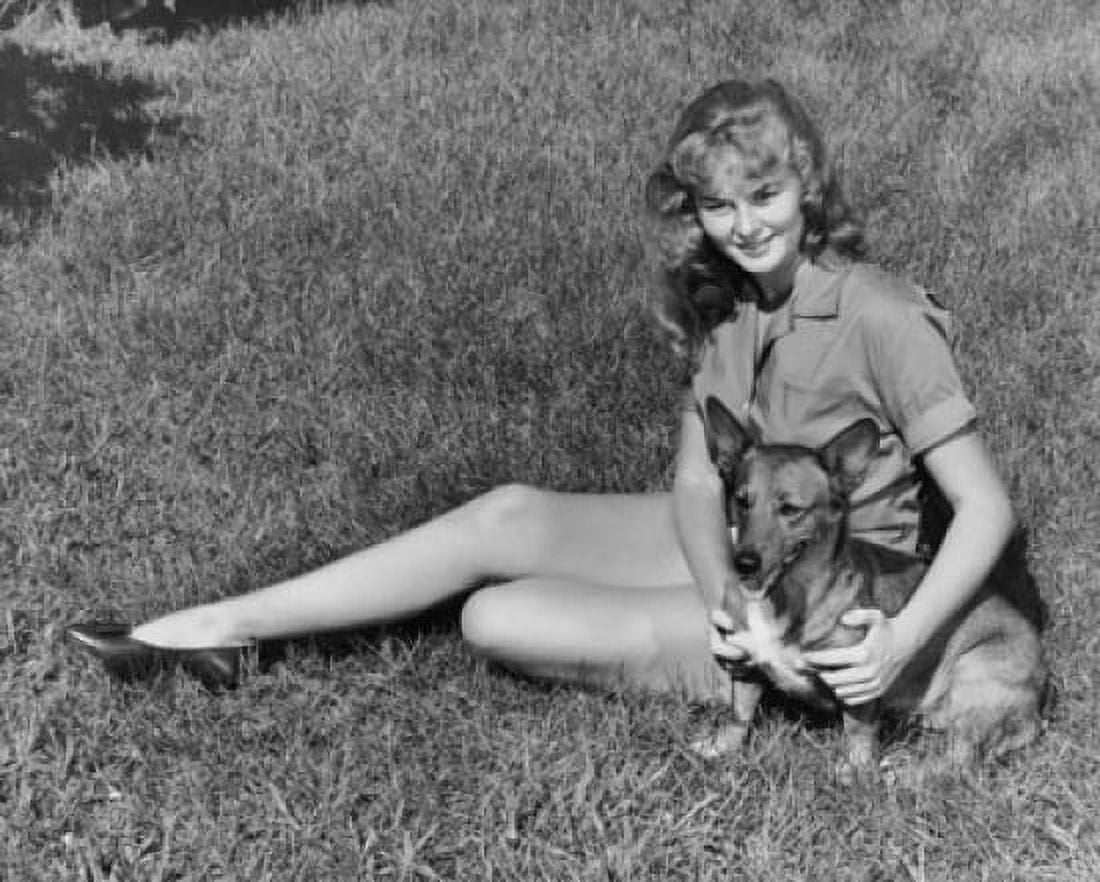 Teenage girl sitting on a lawn with a dog Canvas Art - (18 x 24)