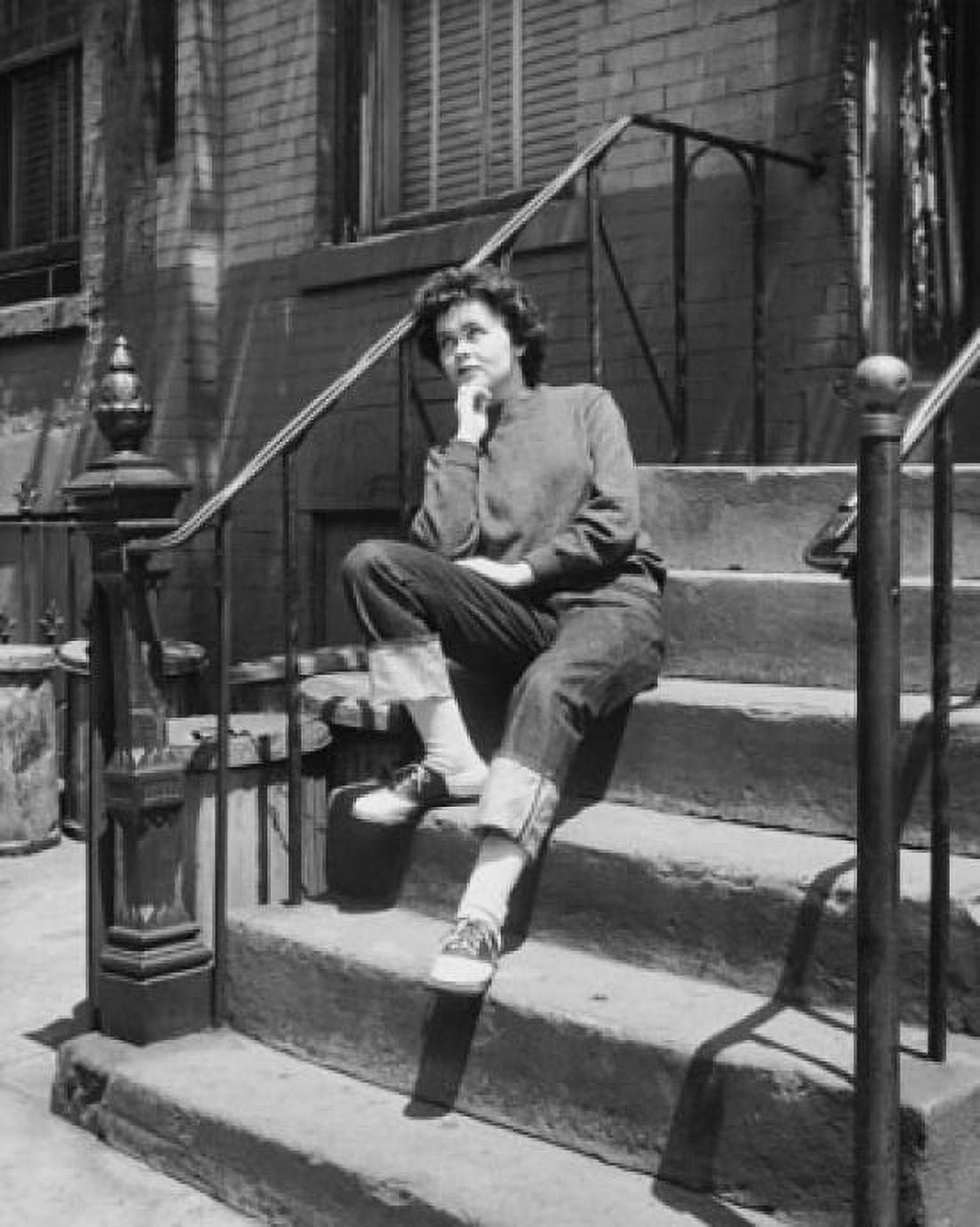 Teenage girl sitting on steps and looking upset Canvas Art - (24 x 36)