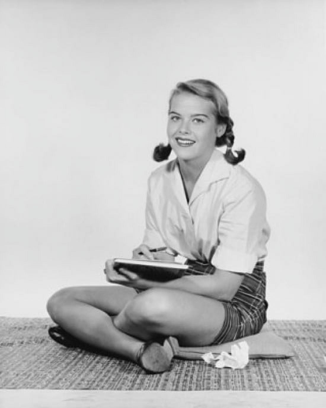 Teenage girl sitting on the floor and smiling Canvas Art - (18 x 24)