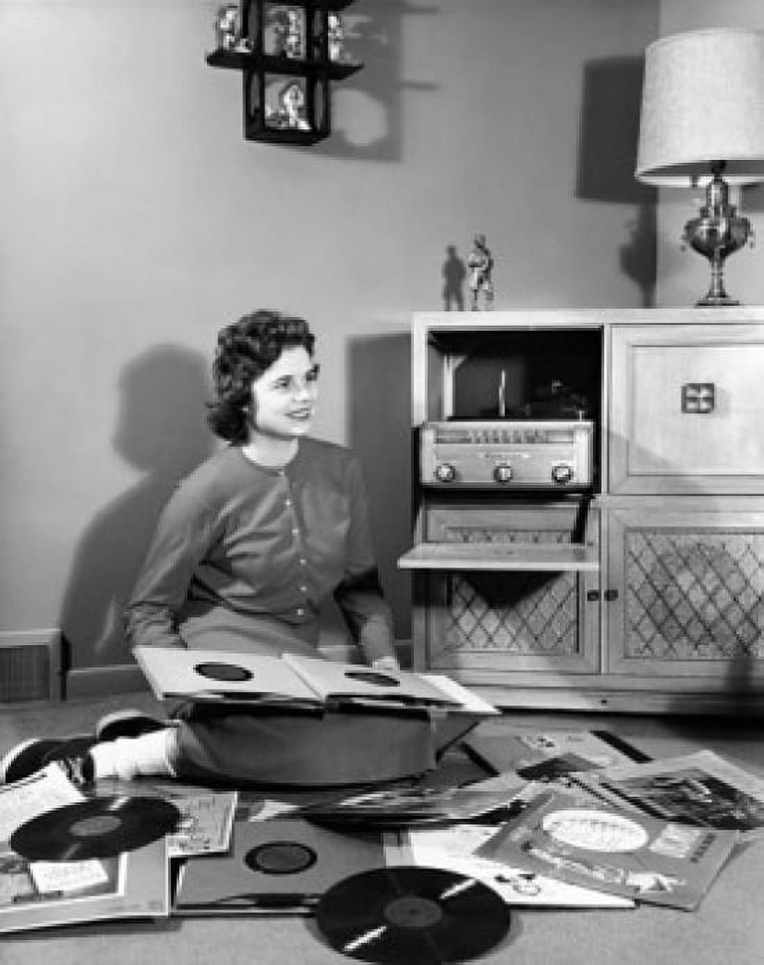 Teenage girl sitting on the floor with records around her Canvas Art - (18 x 24)