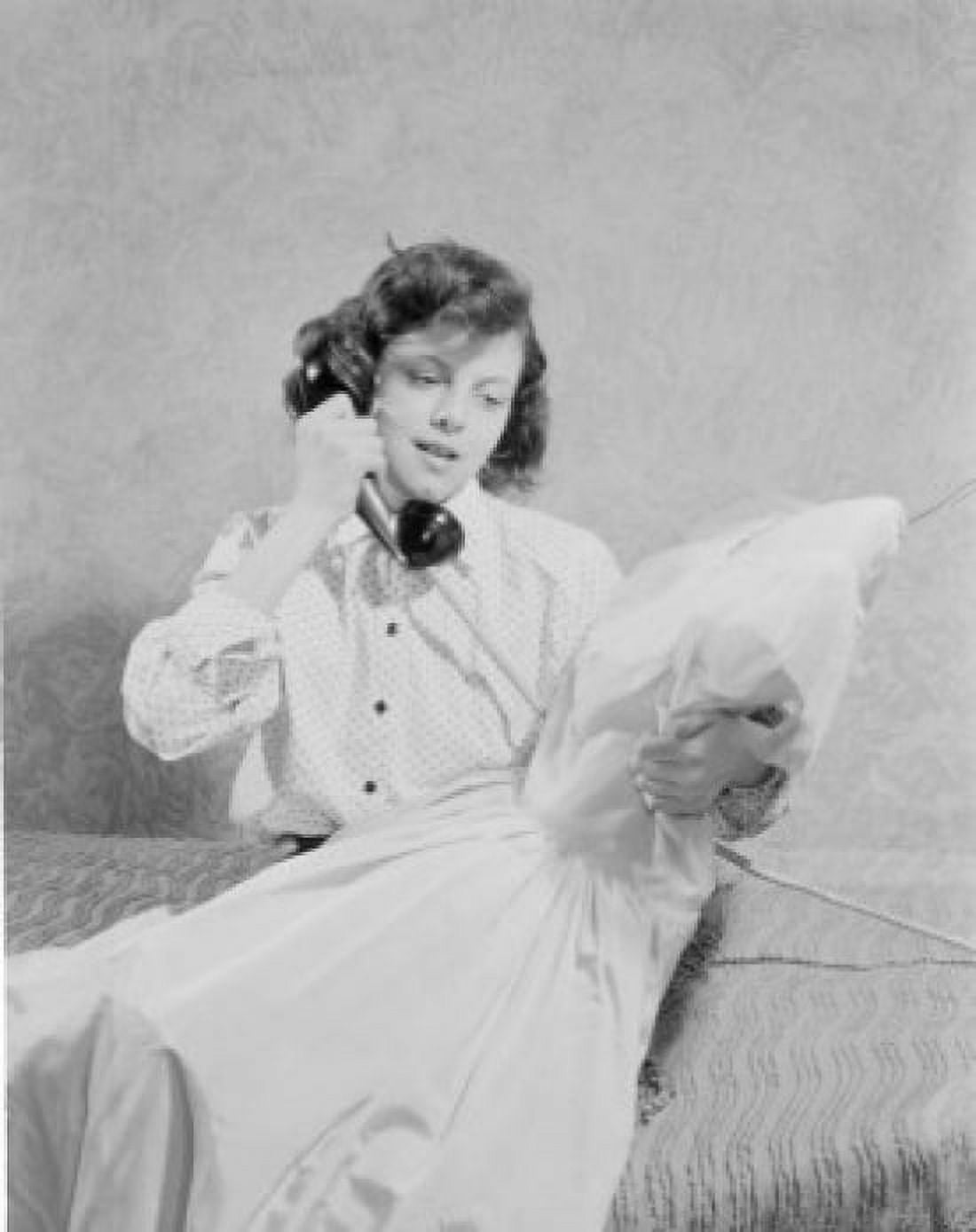 Teenage girl using telephone on bed Canvas Art - (18 x 24)