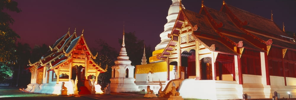 Temple lit up at night Wat Phra Singh Chiang Mai Thailand Canvas Art - Panoramic Images (36 x 12)