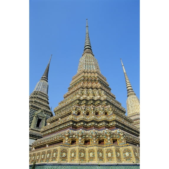 Thailand, Bangkok, Colorful Pointed Steeples Against Clear Blue Sky; Wat Po Poster Print (22 x 36)