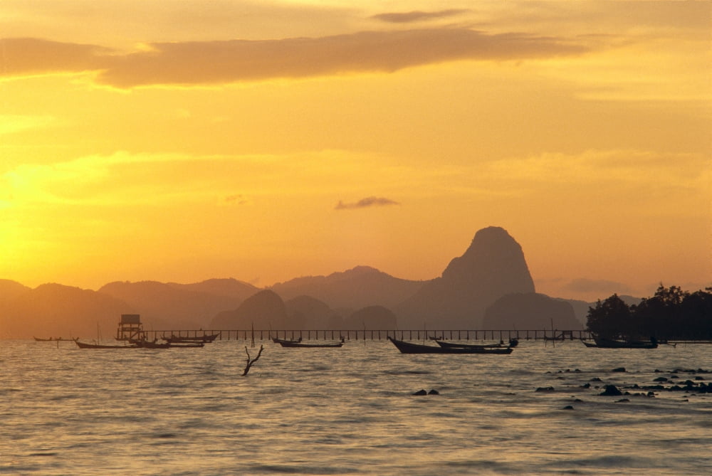 Thailand Phangna Bay Boats Anchored Pier And Mountains At Sunset Golden Orange Sky Canvas Art - Robert Sablan Design Pics (19 x 12)