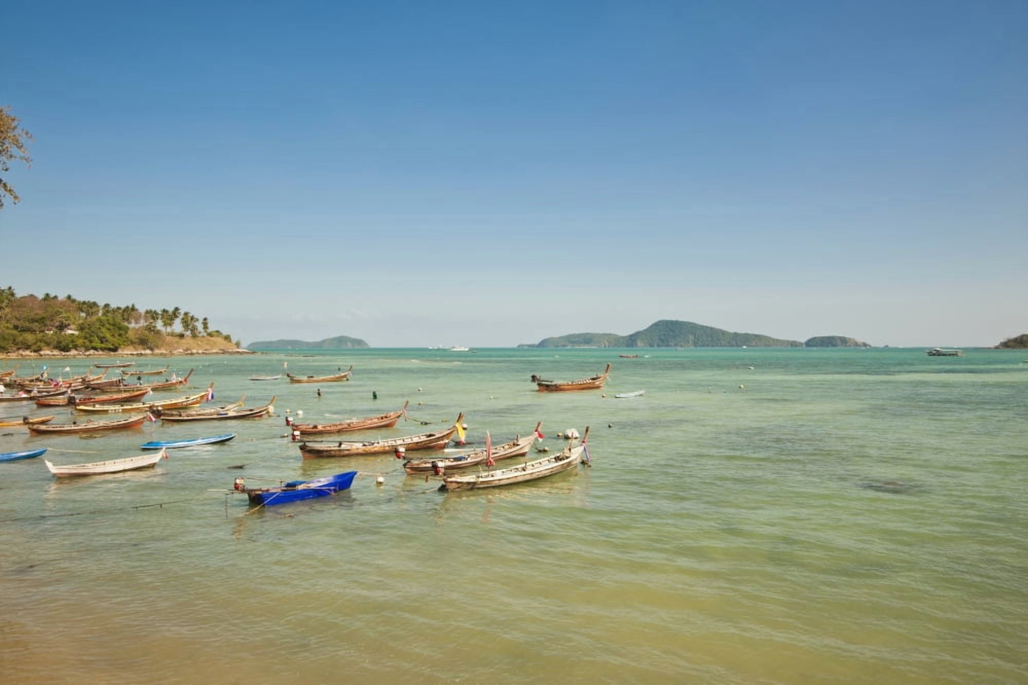 Thailand Phuket Rawaii Beach Longtail boats along the shoreline Land in distance Canvas Art - Bill Brennan Design Pics (19 x 12)