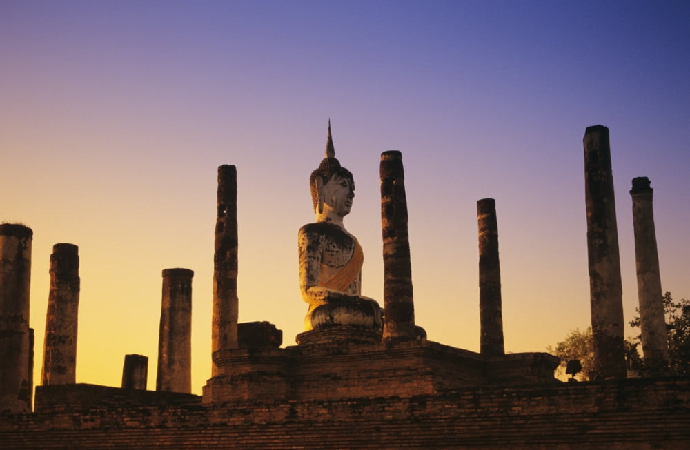 Thailand Sukhothai Wat Mahathat Buddha Statue With Many Pillars At Sunset Blue And Orange Sky Canvas Art - Richard Maschmeyer Design Pics (18 x 11)