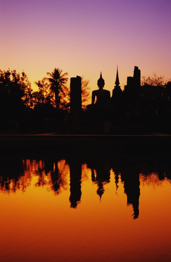 Thailand Sukhothai Wat Mahathat Distant View Of Buddha Statue At Sunset Silhouetted And Reflecting On Water Canvas Art - Richard Maschmeyer Design Pics (12 x 19)