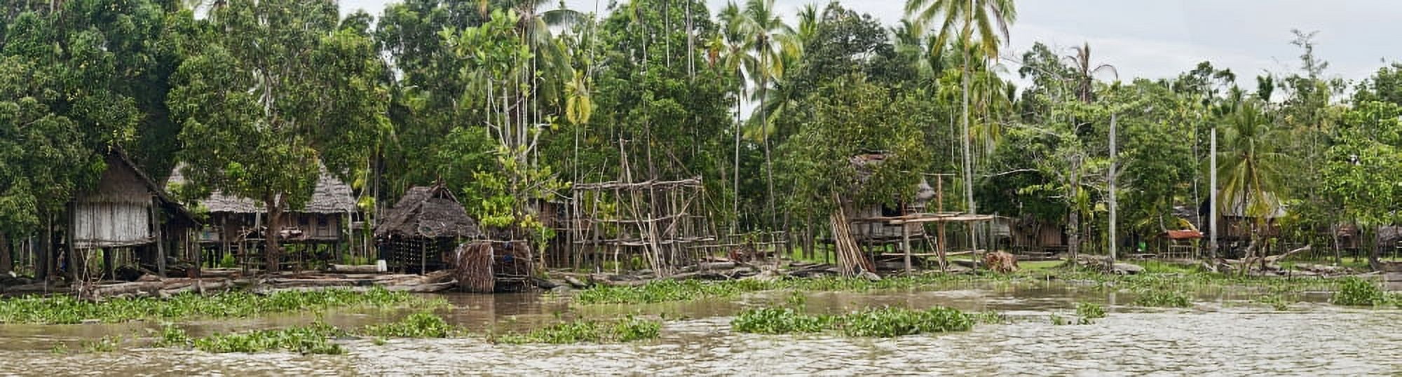 Thatched roof houses on the bank of the Sepik River Papua New Guinea Canvas Art - Panoramic Images (27 x 9)