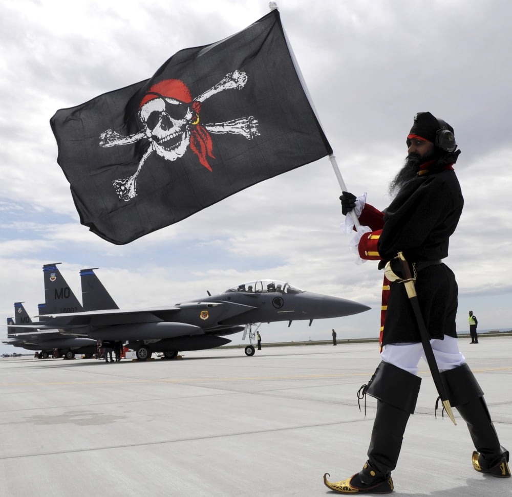 The 428th Fighter Squadron Buccaneer mascot poses in front of three F-15SG fighter jets Canvas Art - Stocktrek Images (29 x 28)