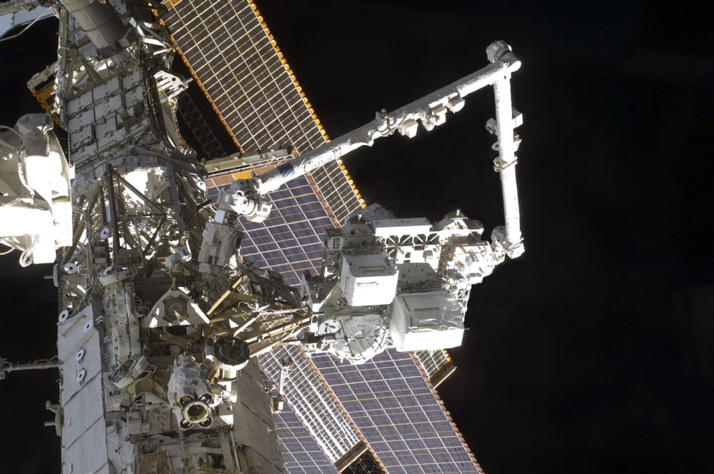 The Canadarm2 mates the Express Logistics Carrier to the Outboard Payload Attachment System Canvas Art - Stocktrek Images (34 x 23)