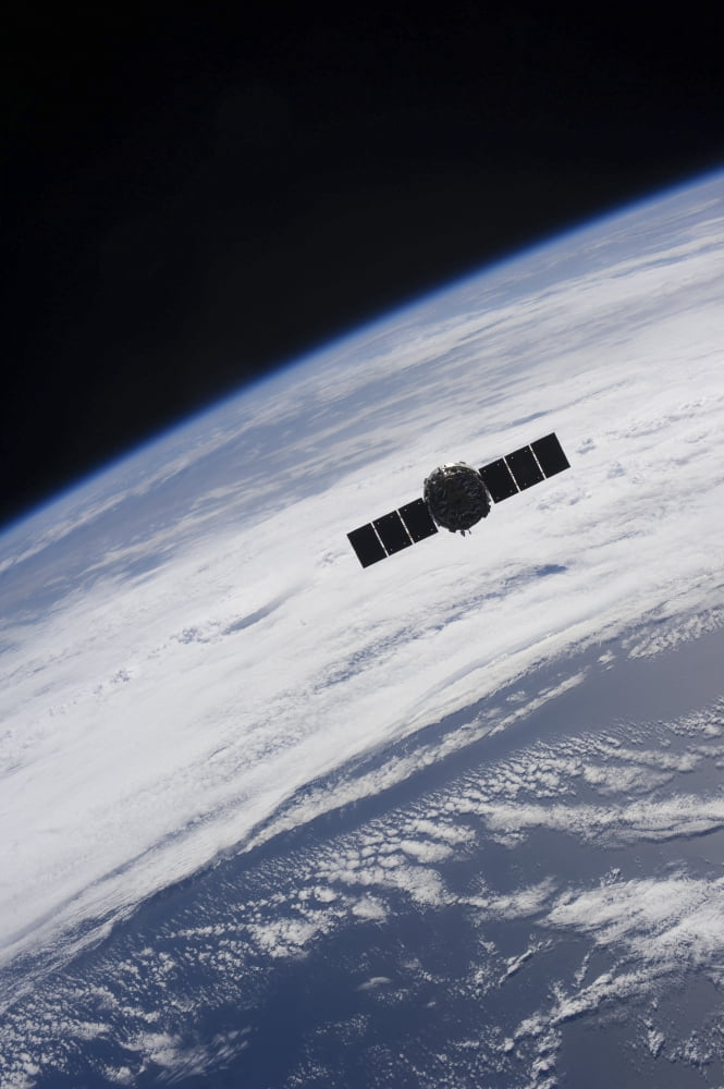 The Cygnus spacecraft begins its separation from the International Space Station Canvas Art - Stocktrek Images (23 x 34)