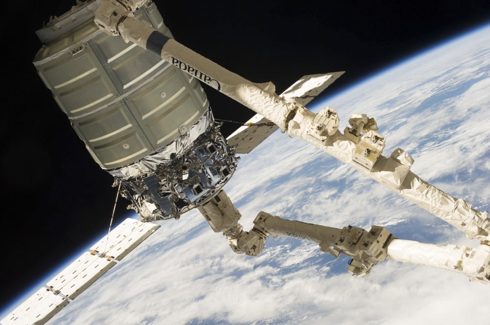 The Cygnus spacecraft in the grasp of Canadarm2 Canvas Art - Stocktrek Images (35 x 23)