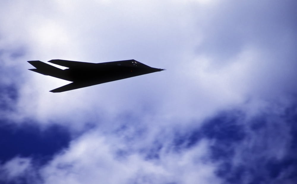 The F-117A Nighthawk climbs into the clouds during a Rim of the Pacific exercise Canvas Art - Michael WoodStocktrek Images (18 x 11)