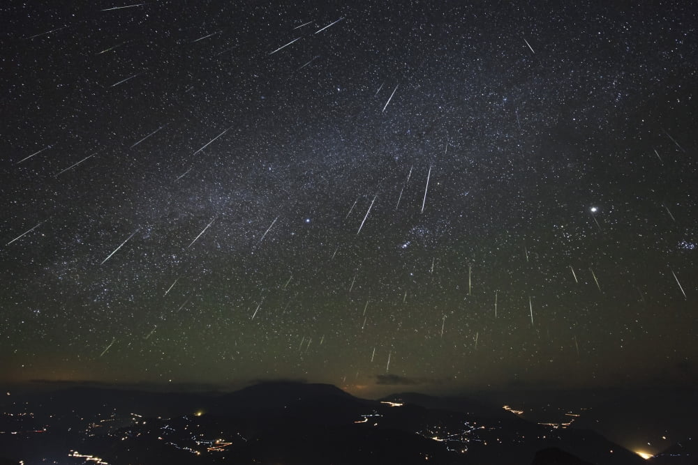 The Geminids meteor shower streaks across the clear sky above Yunnan province of China Canvas Art - Jeff DaiStocktrek Images (34 x 23)