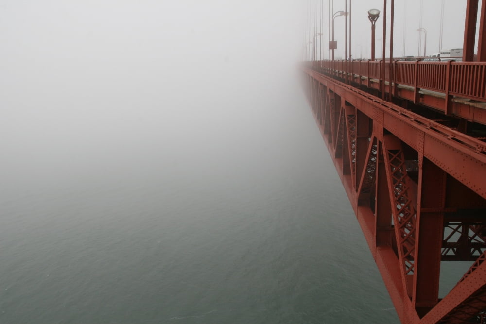 The Golden Gate Bridge Surrounded By Fog San Francisco Canvas Art - Gina Easley Design Pics (34 x 22)