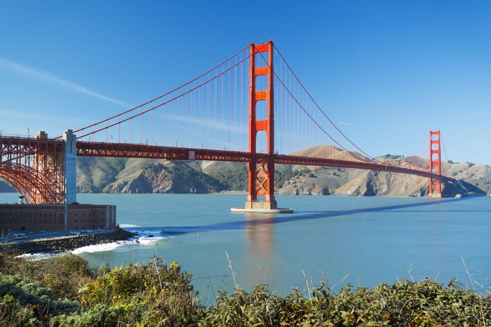 The Golden Gate Bridge in San Francisco with beautiful blue ocean in background Canvas Art - Design Pics Vibe Design Pics (17 x 11)