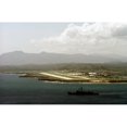 thumbnail image 1 of The Guided Missile Frigate Uss Stark Lower Right Heads Out To Sea From The U.S. Naval Station Guantanamo Bay Cuba. Sept., 1 of 2