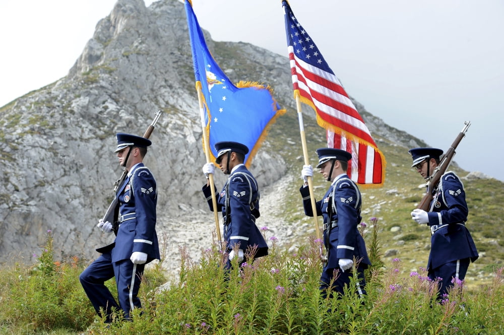 The Honor guard posts the colors before a ceremony at the base of Aguille des Glaciers Italy Canvas Art - Stocktrek Images (35 x 23)