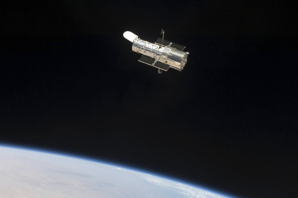 The Hubble Space Telescope in orbit above Earth Canvas Art - Stocktrek Images (34 x 23)