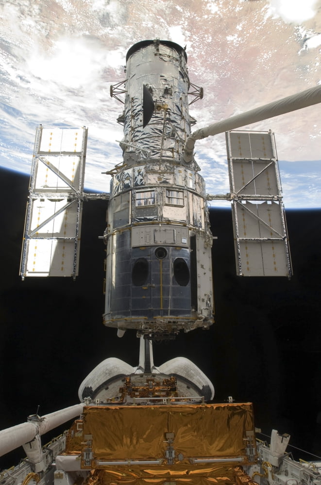 The Hubble Space Telescope is released from the cargo bay of Space Shuttle Atlantis Canvas Art - Stocktrek Images (23 x 34)