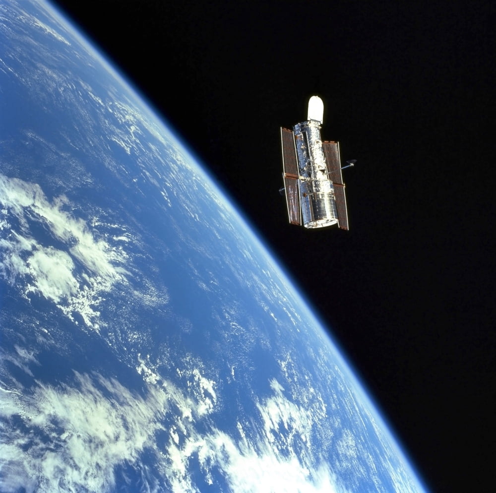 The Hubble Space Telescope with a blue earth in the background Canvas Art - Stocktrek Images (28 x 28)