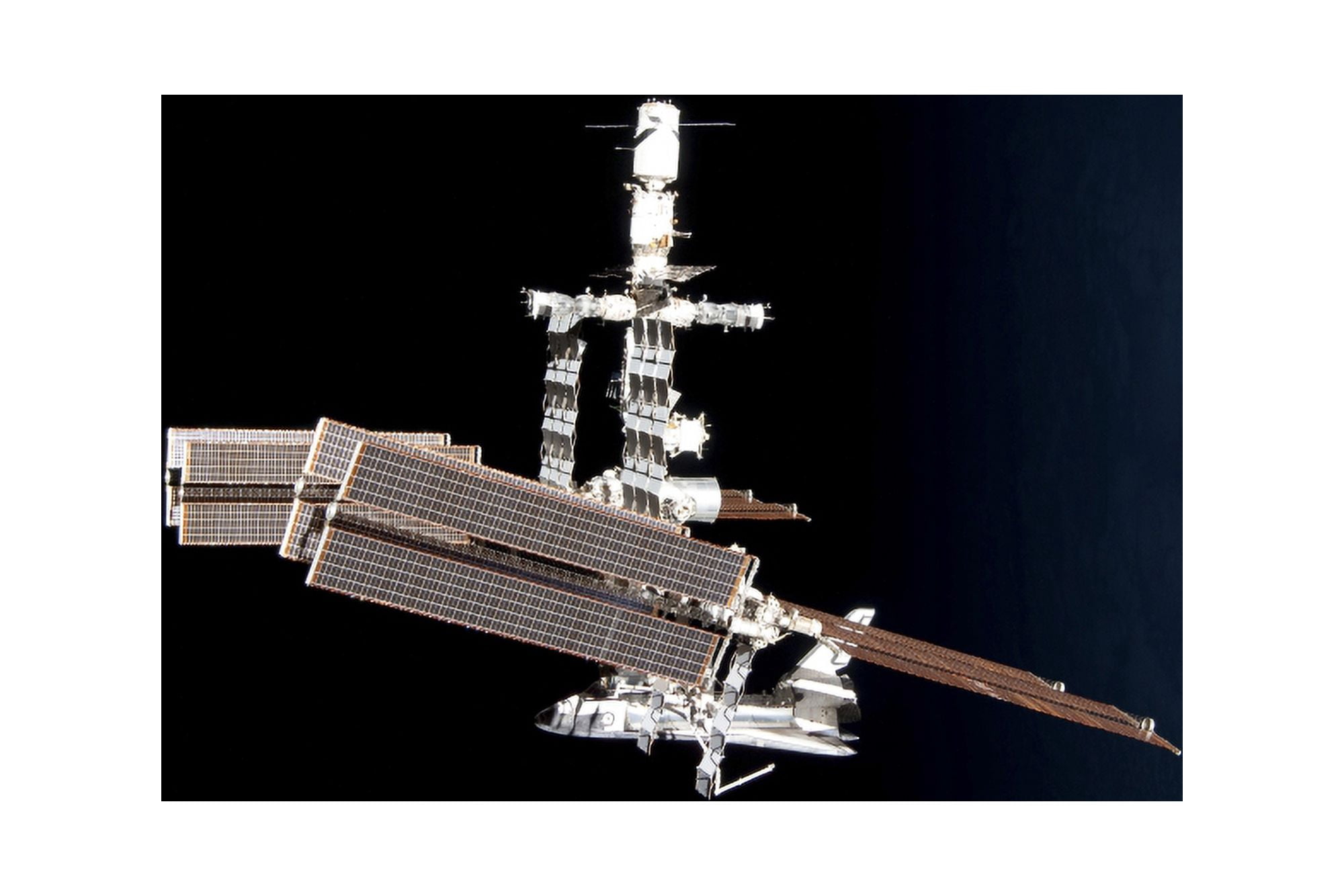 The International Space Station and docked space shuttle Endeavour Canvas Art - Stocktrek Images (34 x 23)