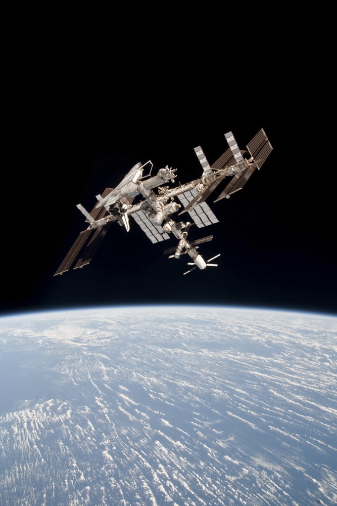 The International Space Station in orbit above Earth Canvas Art - Stocktrek Images (23 x 34)