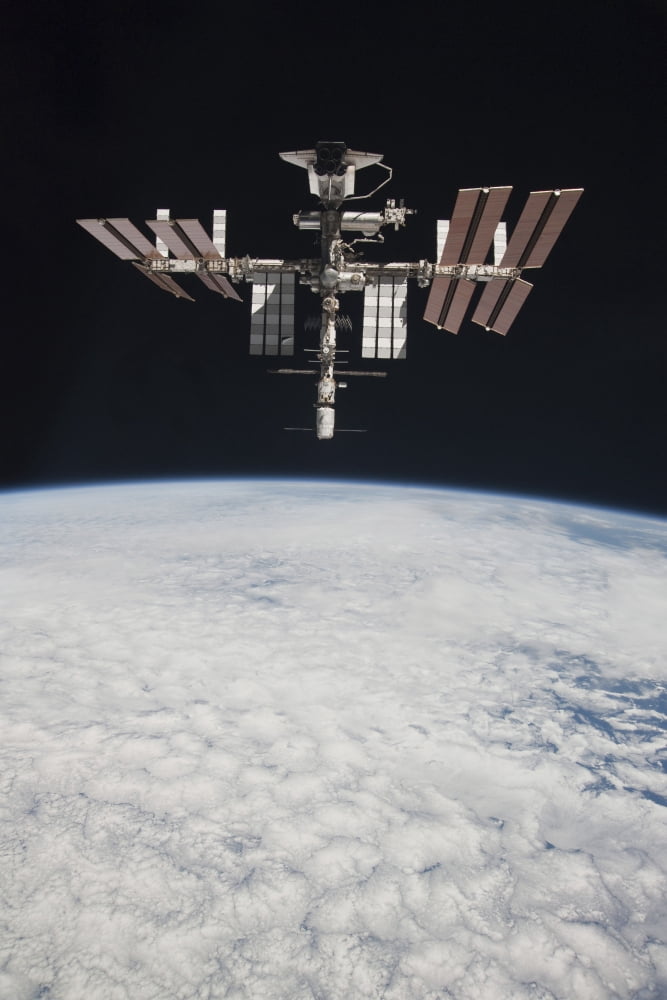 The International Space Station in orbit above Earth Canvas Art - Stocktrek Images (23 x 34)