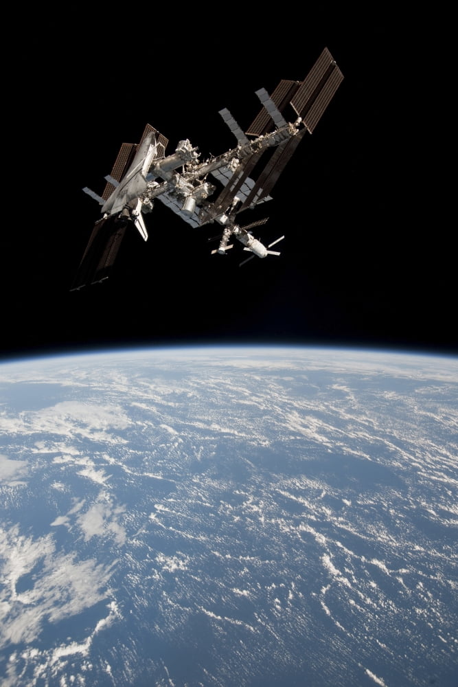 The International Space Station in orbit above Earth Canvas Art - Stocktrek Images (23 x 34)