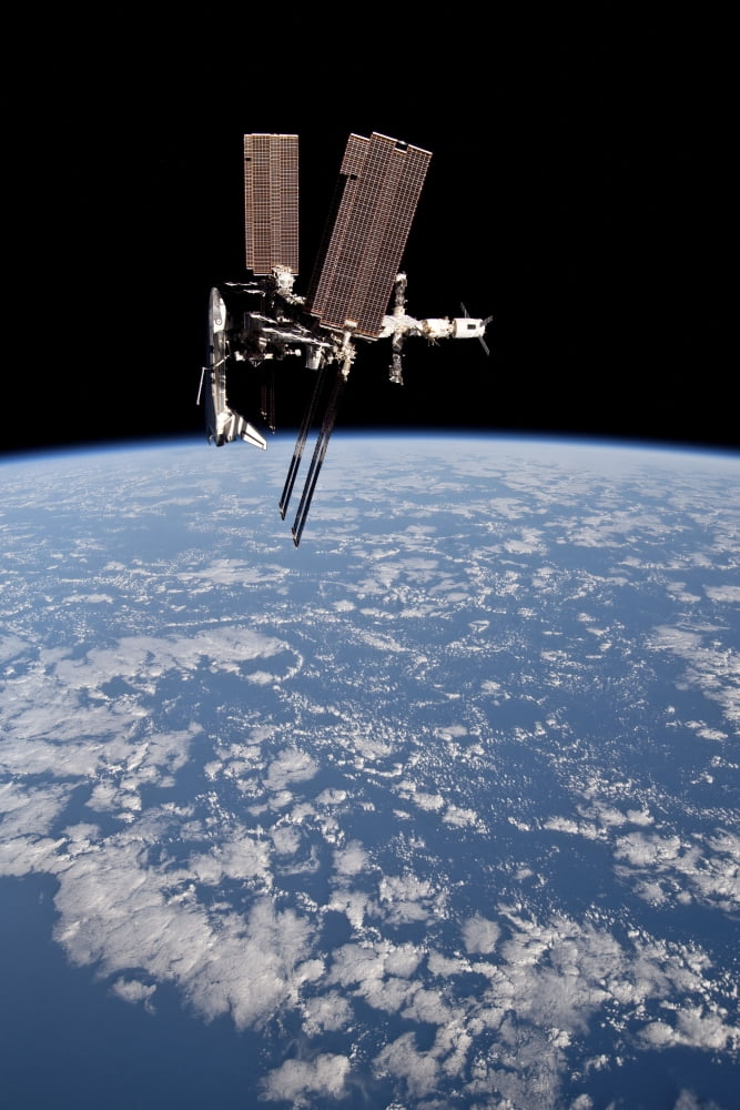 The International Space Station in orbit above Earth Canvas Art - Stocktrek Images (23 x 34)
