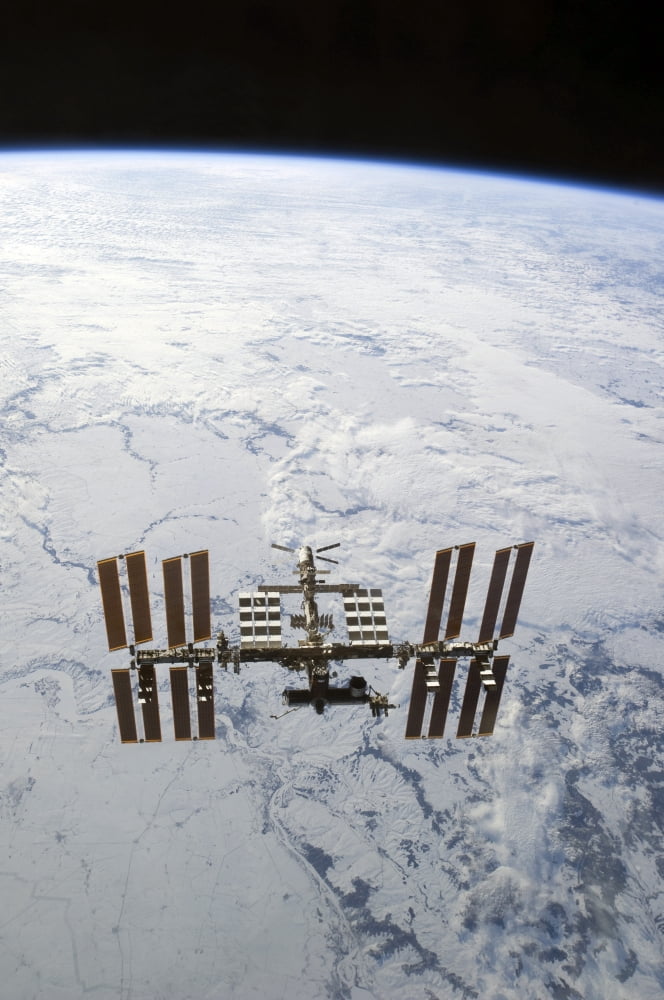 The International Space Station in orbit above Earth Canvas Art - Stocktrek Images (23 x 34)