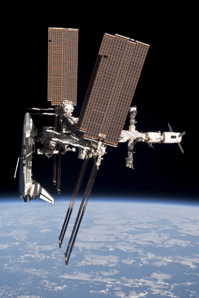 The International Space Station in orbit above Earth Canvas Art - Stocktrek Images (23 x 34)