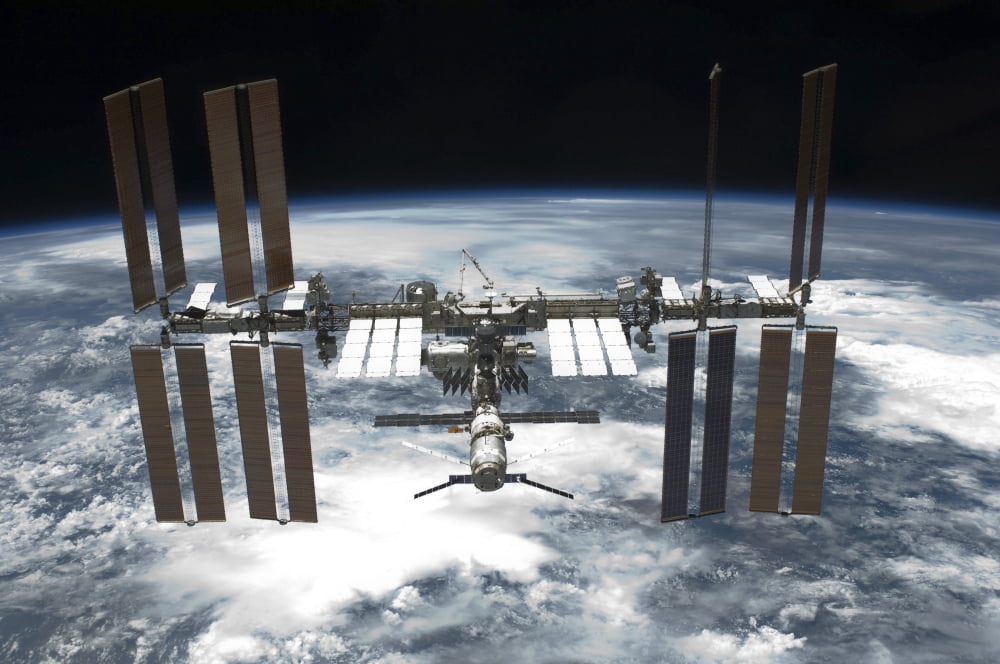 The International Space Station in orbit above Earth Canvas Art - Stocktrek Images (34 x 23)