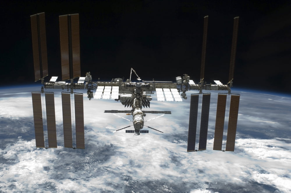 The International Space Station in orbit above Earth Canvas Art - Stocktrek Images (34 x 23)
