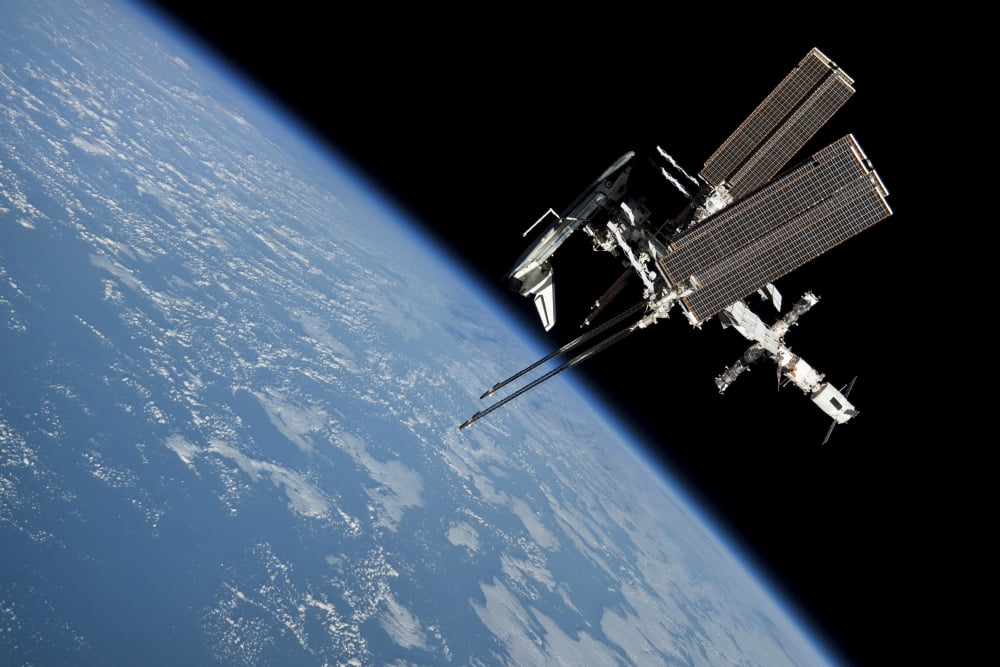The International Space Station in orbit above Earth Canvas Art - Stocktrek Images (34 x 23)