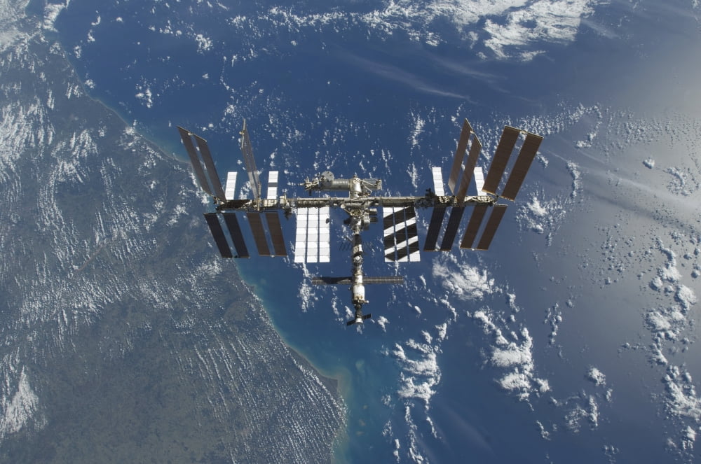 The International Space Station in orbit above Earth Canvas Art - Stocktrek Images (34 x 23)