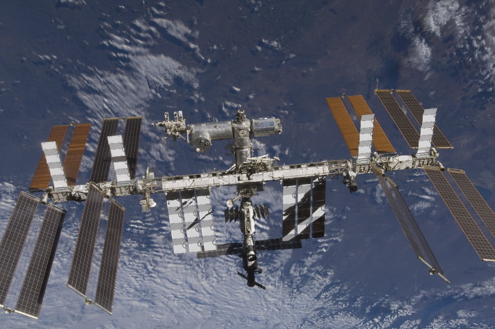 The International Space Station in orbit above Earth Canvas Art - Stocktrek Images (34 x 23)