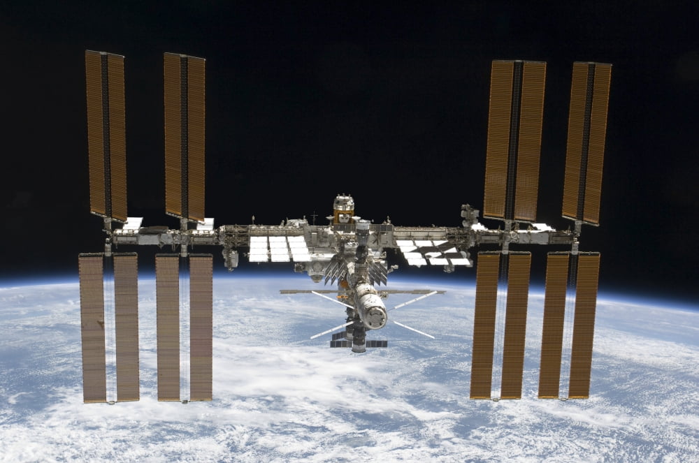 The International Space Station in orbit above Earth Canvas Art - Stocktrek Images (35 x 23)