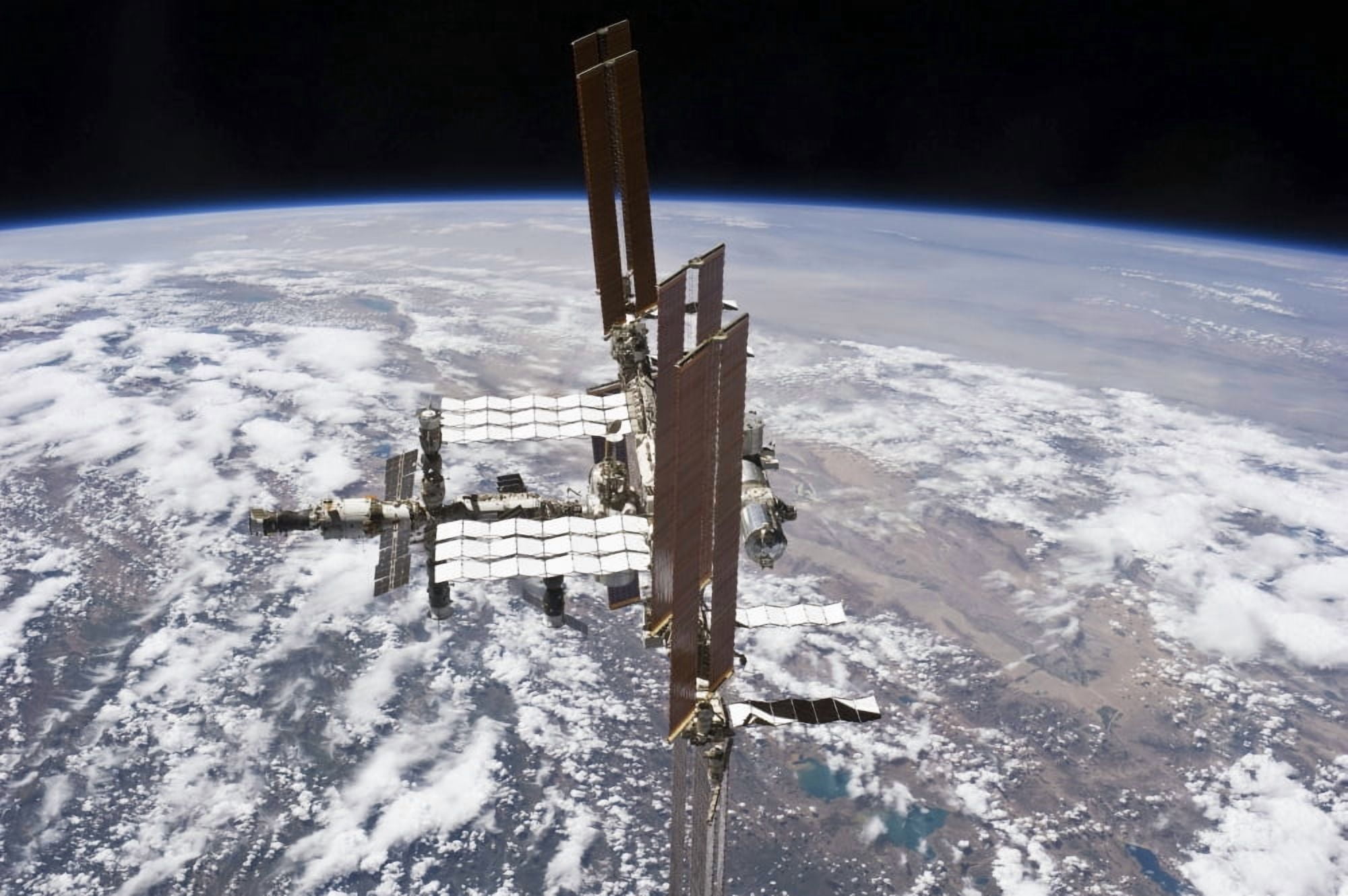 The International Space Station in orbit above Earth Canvas Art - Stocktrek Images (35 x 23)
