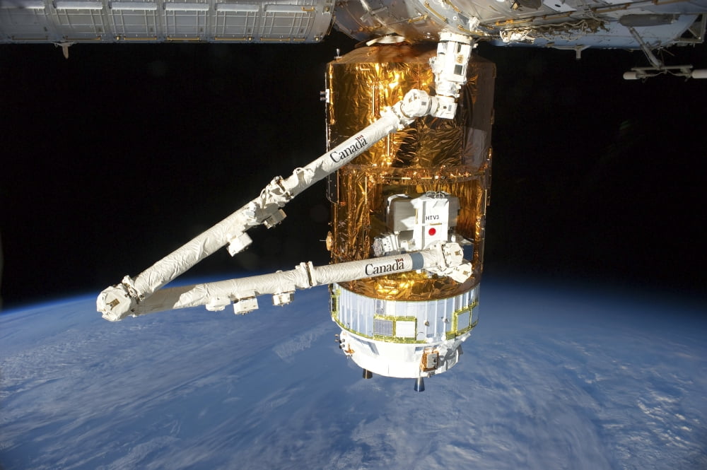 The Japanese H-II Transfer Vehicle above Earth attached to the International Space Station Canvas Art - Stocktrek Images (34 x 23)