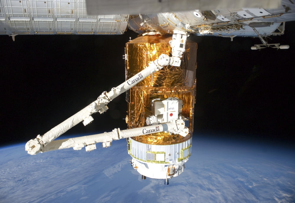The Japanese H-II Transfer Vehicle attached to the Harmon node on the ISS Canvas Art - Stocktrek Images (35 x 24)