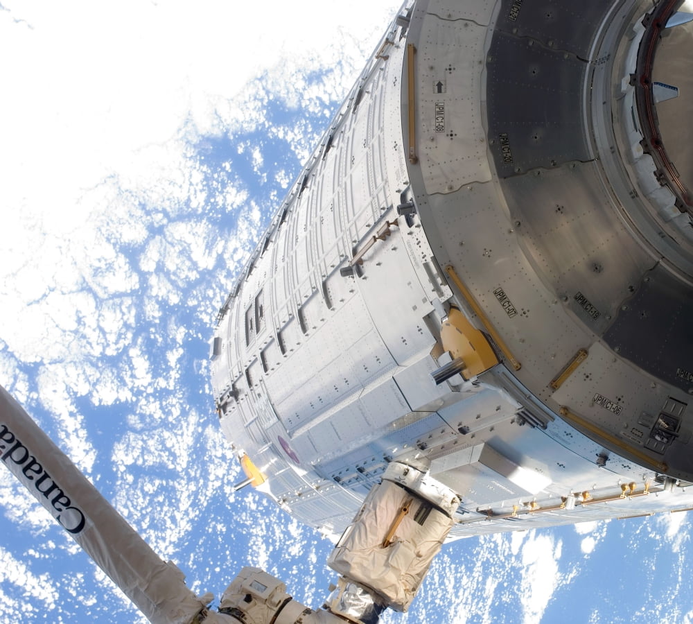 The Kibo Japanese Pressurized Module in the grasp of the robotic Canadarm2 Canvas Art - Stocktrek Images (29 x 26)