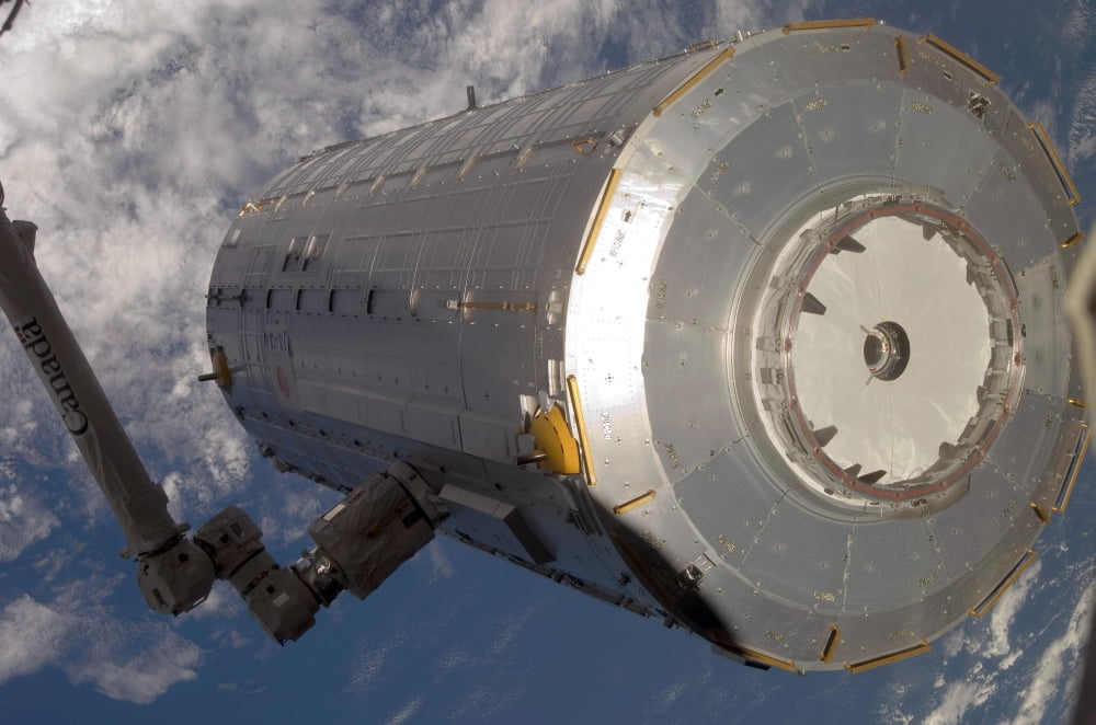 The Kibo Japanese Pressurized Module in the grasp of the robotic Canadarm2 Canvas Art - Stocktrek Images (34 x 23)