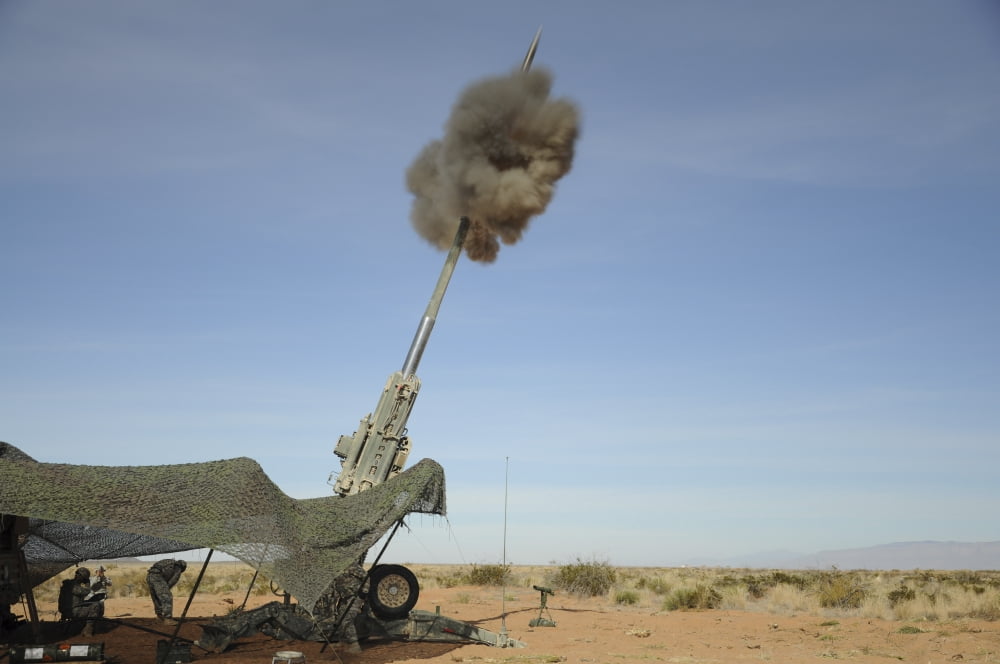 The M982 Excalibur 155mm round leaves the barrel of an M777 Howitzer Canvas Art - Stocktrek Images (35 x 23)