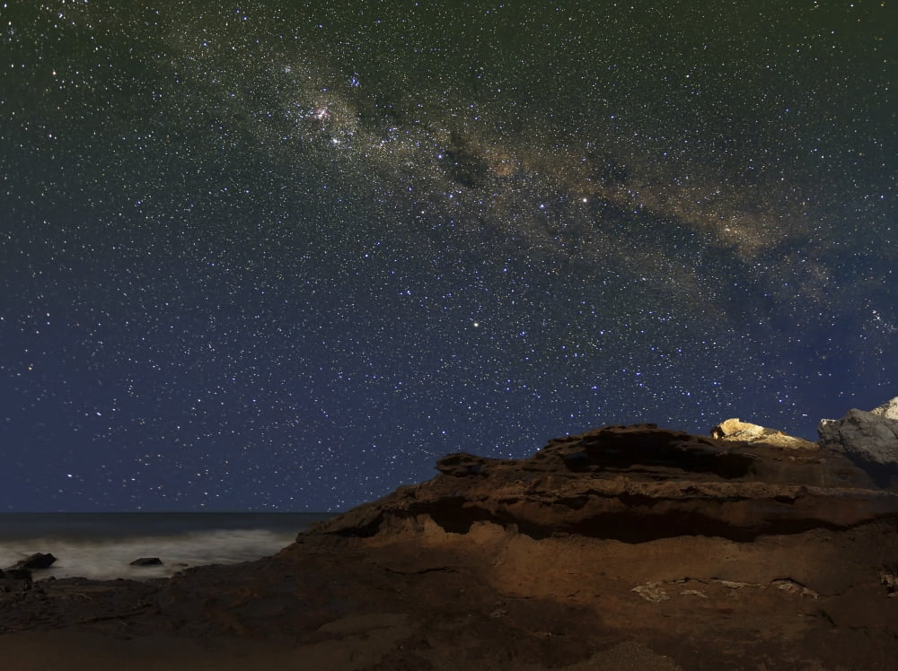 The Milky Way over the cliffs of Miramar Argentina Canvas Art - Luis ArgerichStocktrek Images (33 x 24)