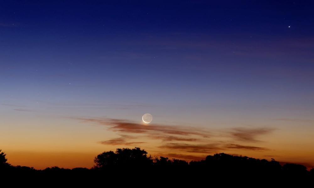 The Moon and Jupiter in conjunction with Jupiters moons Canvas Art - Luis ArgerichStocktrek Images (19 x 11)