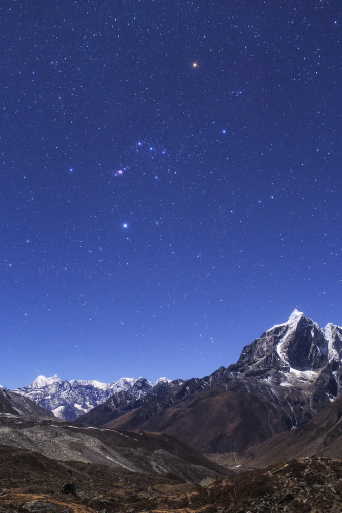 The Orion constellation above the moonlit landscape of the Himalayas in Nepal Canvas Art - Jeff DaiStocktrek Images (12 x 17)