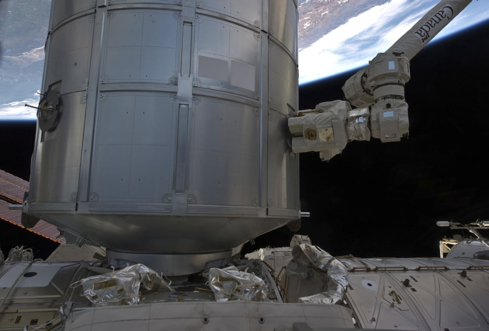 The Permanent Multipurpose Module in space shuttle Discoverys payload bay Canvas Art - Stocktrek Images (34 x 23)