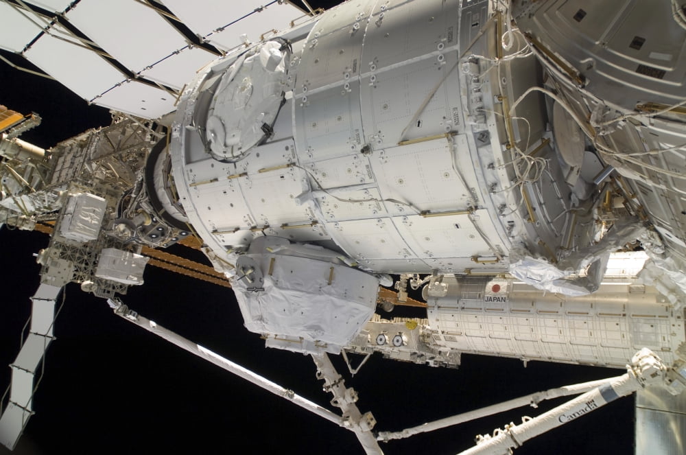 The Pressurized Mating Adapter 3 in the grasp of the Canadarm2 Canvas Art - Stocktrek Images (34 x 23)