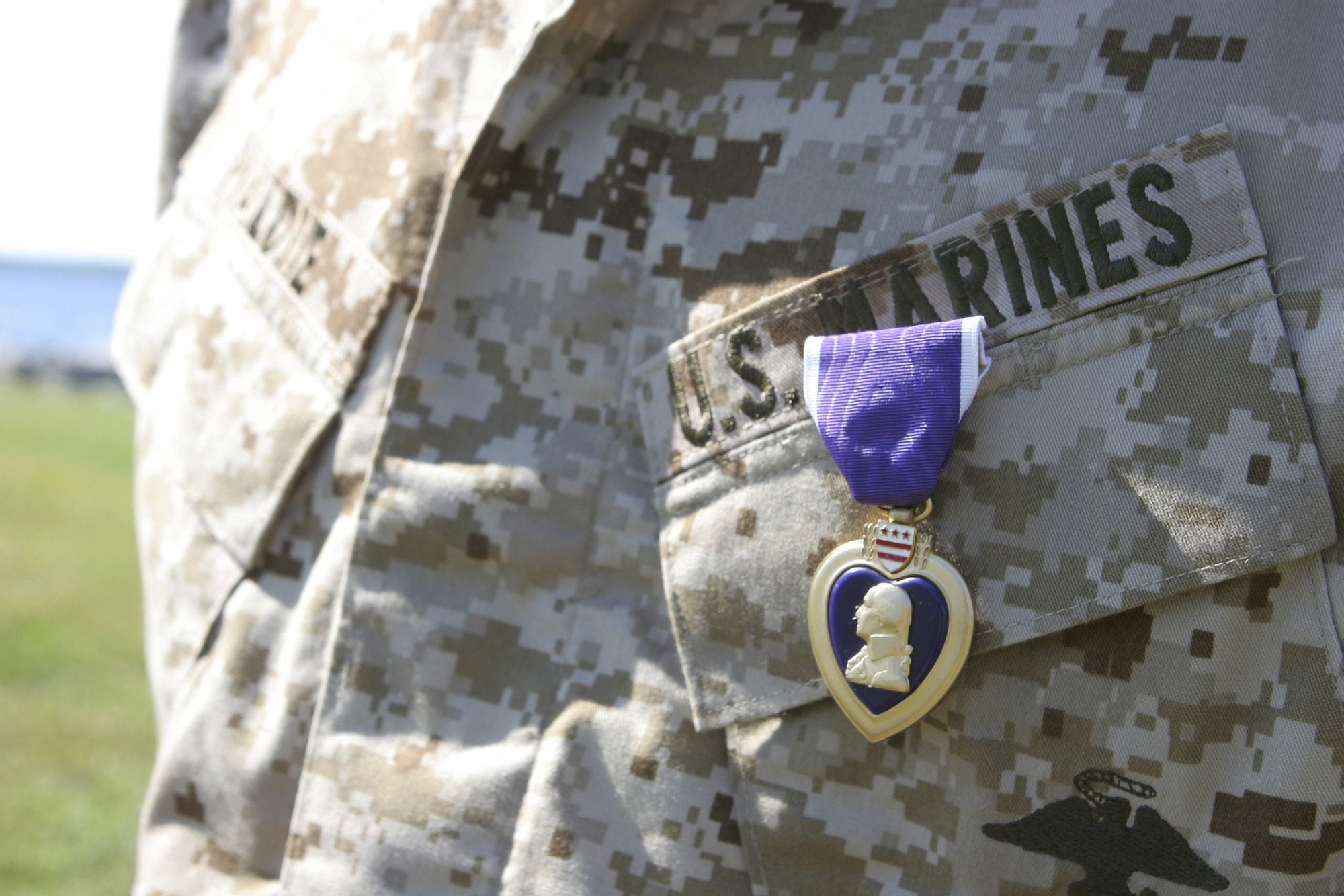 The Purple Heart award hangs over the heart of a US Marine Canvas Art - Stocktrek Images (34 x 23)